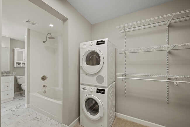 Walk-in closet with Bosch high efficient laundry - Minnetonka Edgewater Apartments and Boat Slips