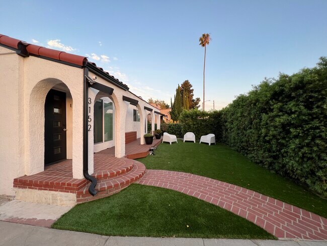 New turf front yard and fresh landscaping - 3152 Ivy St