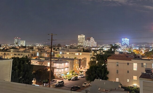 Rooftop deck view at night - 1800 Butler Ave
