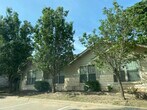 Three parking spaces. Multiple trees - 105 Bolero Way