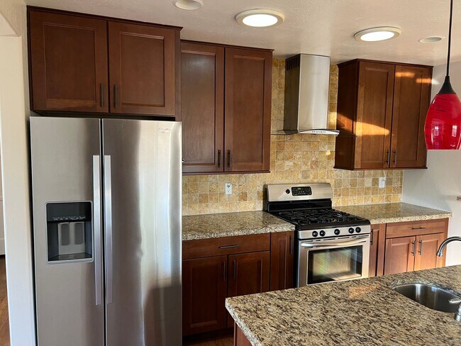 Building Photo - Updated 2BR/1BA with a pool, solar and yar...