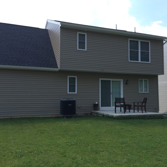 Rear concrete porch and yard - 123 Whisper Ridge Dr