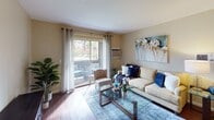 Located at 715 Ash in San Marcos, this single-story unit at Bella offers a thoughtfully designed layout that balances comfort and functionality. The living room serves as the heart of the home, featuring warm wood-style flooring, neutral-toned walls, and a sliding glass door that opens onto a private balcony with outdoor views, allowing natural light to fill the space. A dedicated dining area sits adjacent to the living room, providing an intimate setting for meals.

The kitchen is efficiently arranged with warm wood cabinetry, granite-style countertops, a stainless steel sink, and white appliances, including a refrigerator, dishwasher, and range. The wood-style flooring continues throughout, adding visual continuity.

Two bedrooms offer comfortable retreats, each with carpet flooring, natural light from windows with views of the surrounding greenery, and closet storage. The rooms maintain the same warm, neutral palette found throughout the unit.

The bathroom is well-equipped with a granite-topped vanity, a large framed mirror, warm wood cabinetry, and a shower-tub combination. Overall, the unit presents a cohesive, comfortable living environment with practical features throughout.