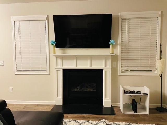Relax in the living room with a 65 inch smart TV and fireplace - 6126 Centennial Run