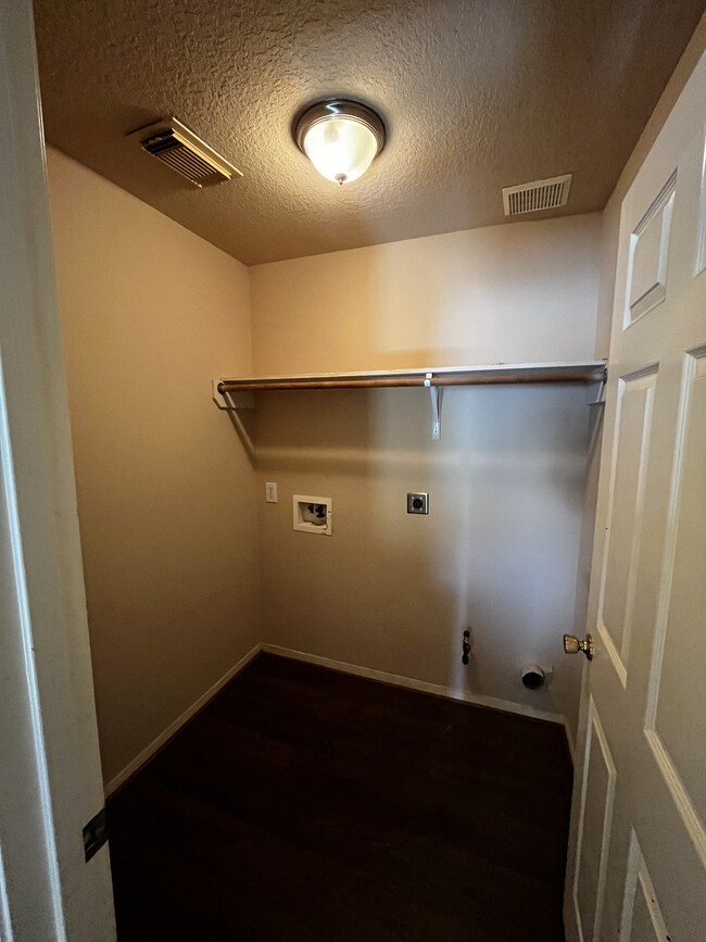 Laundry room with new paint & new floor - 19410 Maywood Falls Cir
