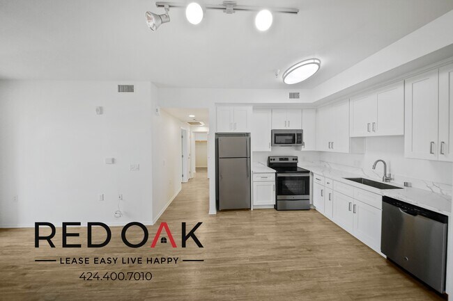 Building Photo - ~1 Month FREE~ Sunlit and Inviting Two Bed...