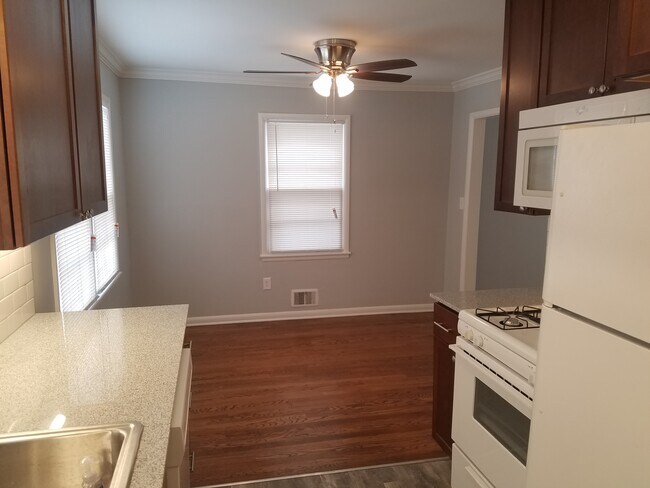 Kitchen, looking into dining room. - 6644 Walrond Ave