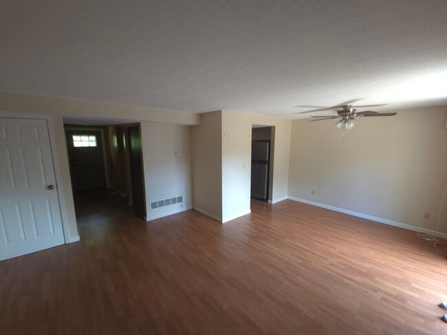Main floor living area from other corner. - 7618 Thames Ct
