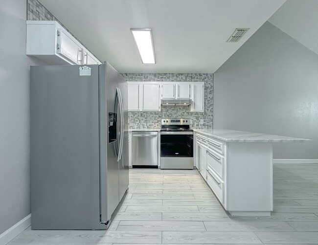 Building Photo - MODERN! Walk to FSU 2/2 w/ Marble Counters, Stainless Steel Appliances, & Privacy Fenced Yard! Av...
