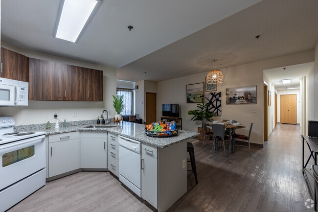 4BR, 4BA - 1,227SF - Kitchen - The Quad on Delaware Apartments
