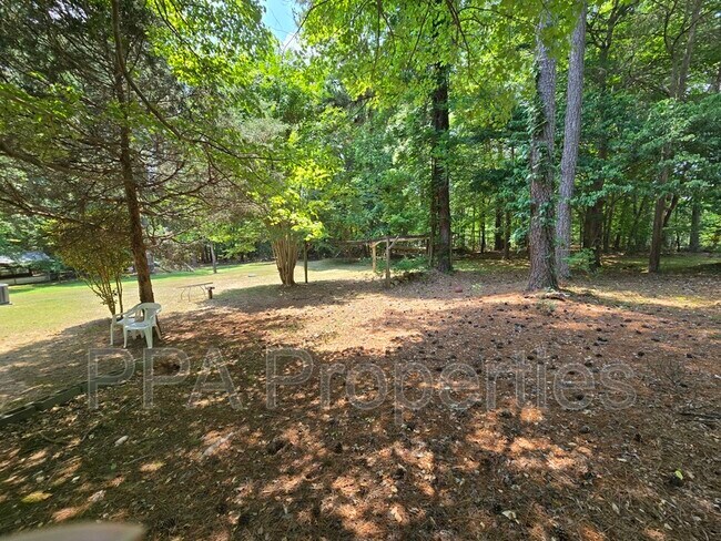 Foto del edificio - 7122 Ramblewood Dr
