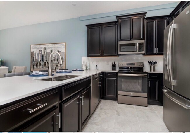 Foto del edificio - BEAUTIFUL CHAMPIONS GATE 2 BED 2 BATH COND...