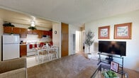 Located at 4260 Palm Ave in San Diego, CA, this 2-bedroom, 1-bathroom single-floor residence offers a practical and comfortable layout ideal for everyday living. The open-plan living and dining area is carpeted throughout, providing a warm and inviting atmosphere. Large windows flood the living room with natural light while framing views of mature trees outside, creating a peaceful indoor-outdoor connection. The kitchen is well-equipped with warm wood-toned cabinetry, ample storage, a full suite of appliances including a refrigerator and range, and a ventilation hood — all efficiently arranged for ease of use. A dedicated dining area sits adjacent to the kitchen, making mealtime convenient. The primary bedroom is a comfortable retreat featuring carpet flooring, a window overlooking lush greenery, and textured ceiling detail consistent throughout the home. The second bedroom offers similar features, providing flexibility as a guest room or home office. The full bathroom includes a single-sink vanity with wood cabinetry, a tub-shower combination, and tile flooring. Throughout the residence, a textured ceiling, neutral wall tones, and carpeted floors create a cohesive and functional living environment in the heart of San Diego.