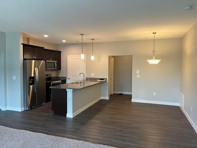 Entry, kitchen, dining. Door to pantry/laundry - 2177 Willenbrock Cir