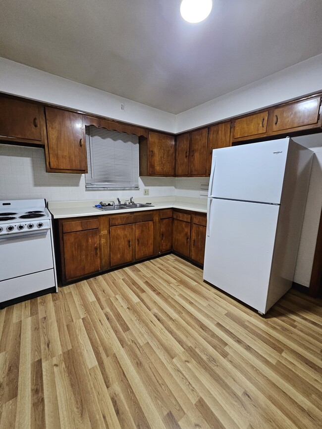 The kitchen has brand new flooring. - 218 Randel Ave