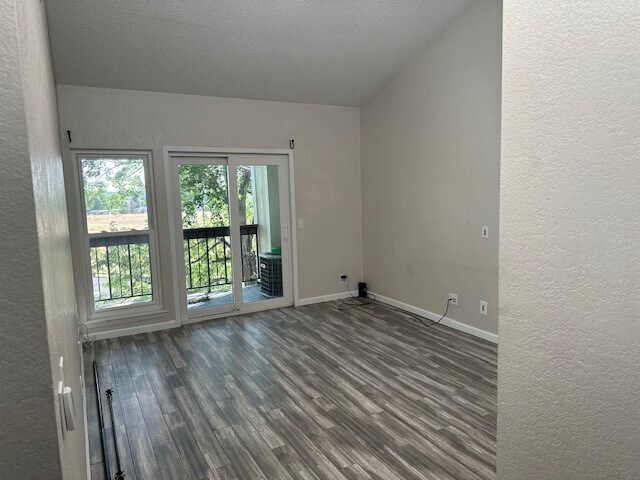 LIVING ROOM WITH LAMINATE FLOORING AND BALCONY - 8645 Clay St