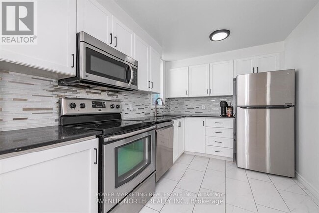 Photo du bâtiment - 1440-1440 Heron Rd