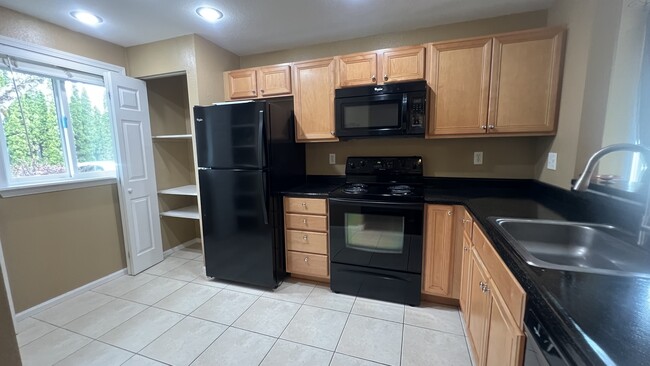 Kitchen on the left side from Foyer - 712 126th Ave NE