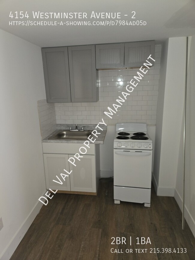 Building Photo - This updated 2nd Floor Apartment in the Mi...