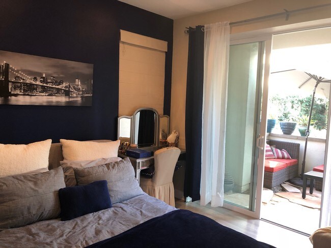 Furnished Bedroom with Patio - 12818 N Seaglass Cir