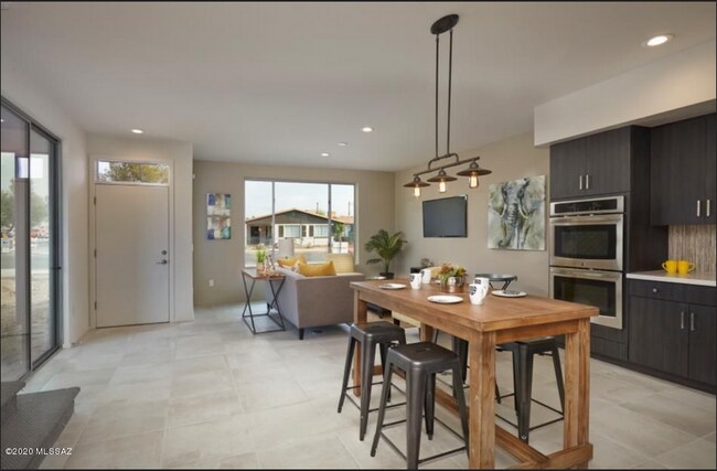 Model picture - Rental house has blinds on all windows and LVP flooring downstairs - 8682 E Avant Garde Way