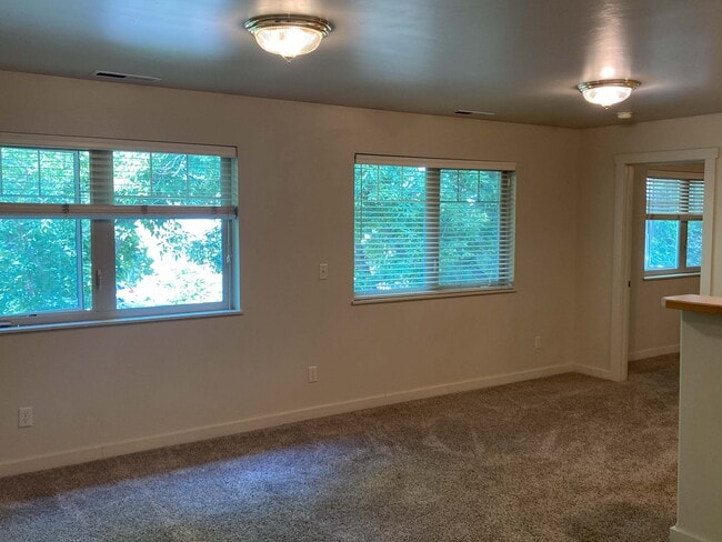 West facing windows with blinds - 607 Professional Dr