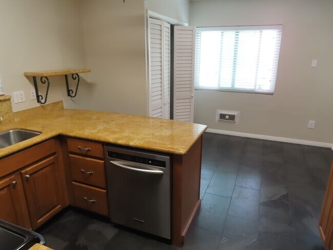 Building Photo - Nicely Updated Two Bedroom Condo with In-U...