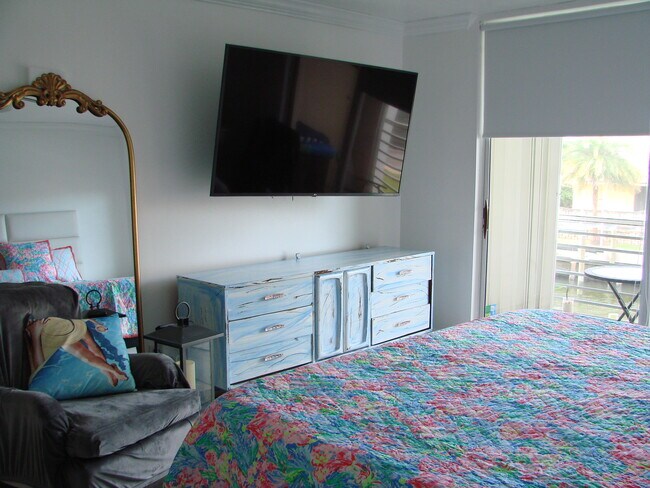 Primary Bedroom- 65" smart TV - 105 Paradise Harbour Blvd