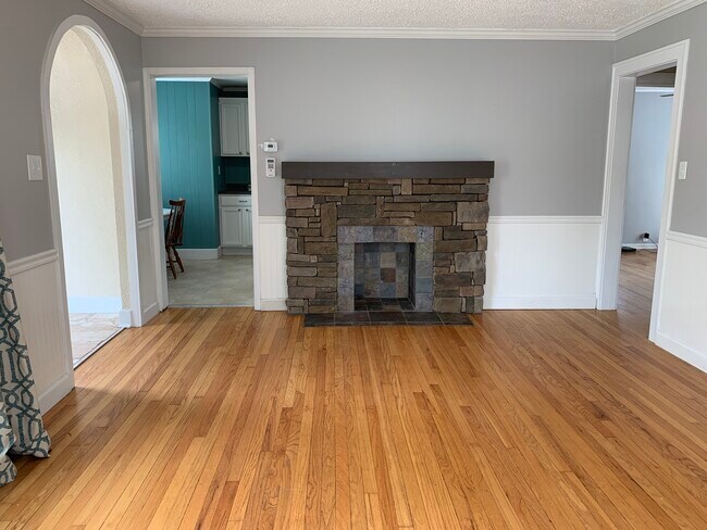 Living room (non-functioning stone fireplace) - 4437 Sunrise Dr