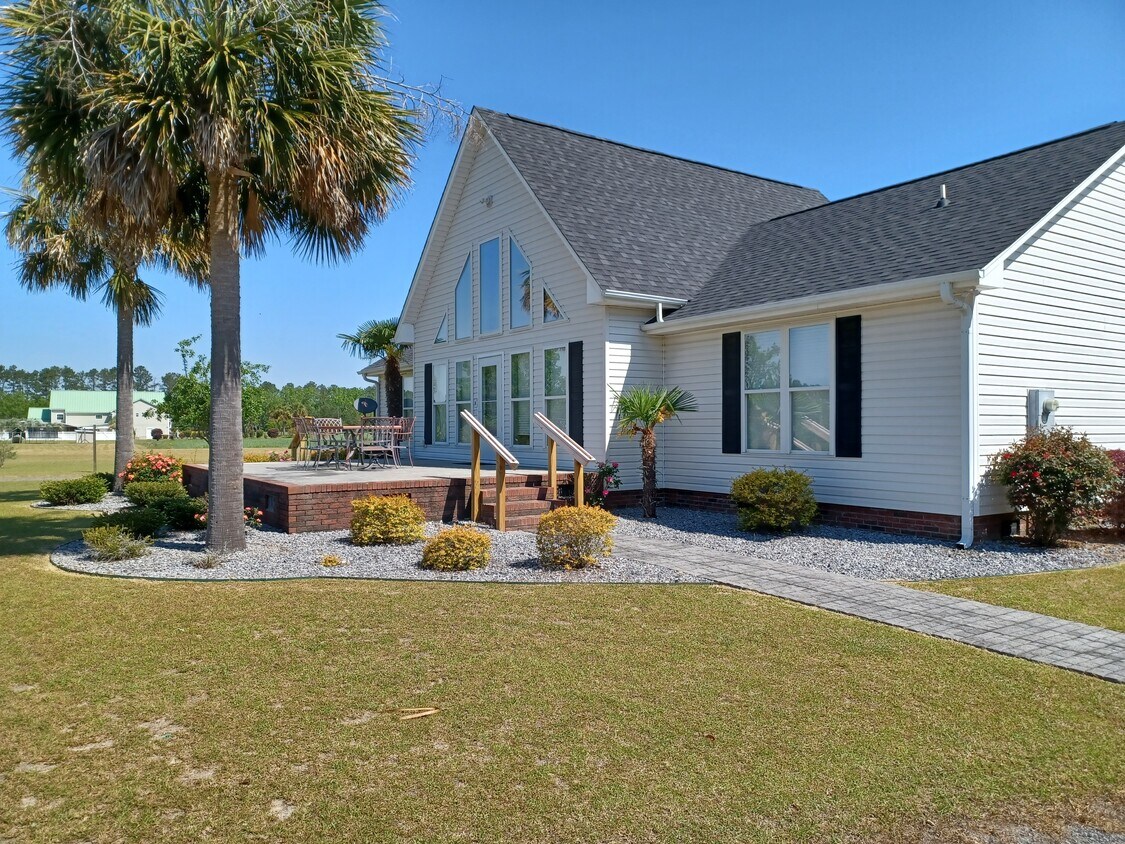 Front of house with a large patio - 1953 S Hill Rd