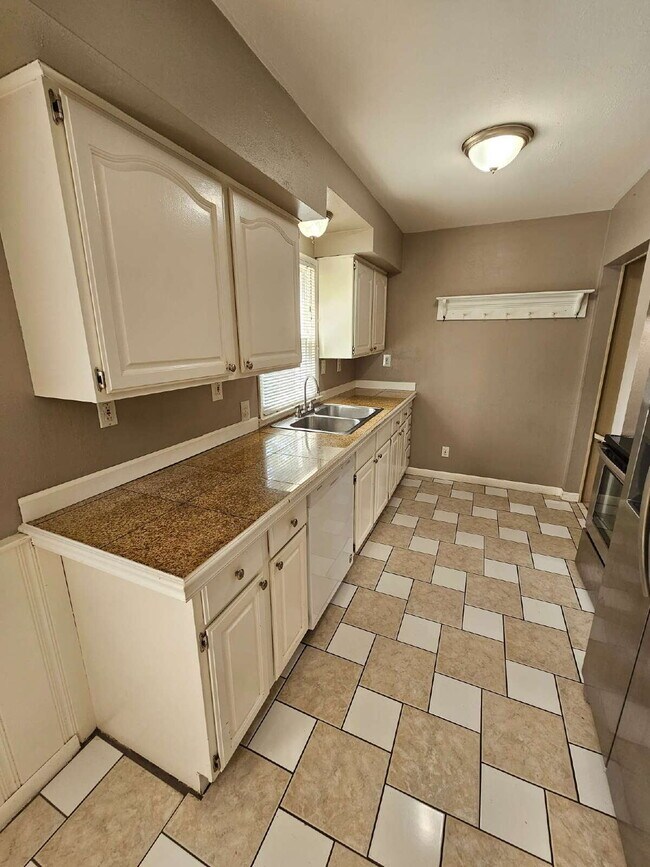 Building Photo - 3-Bedroom, 2-Bathroom Ranch with Hardwood Flooring, Tiled Kitchen and Finished Basement with a 2 ...