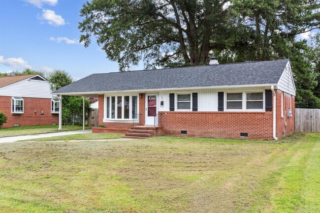 Building Photo - Charming brick rancher with modern kitchen...