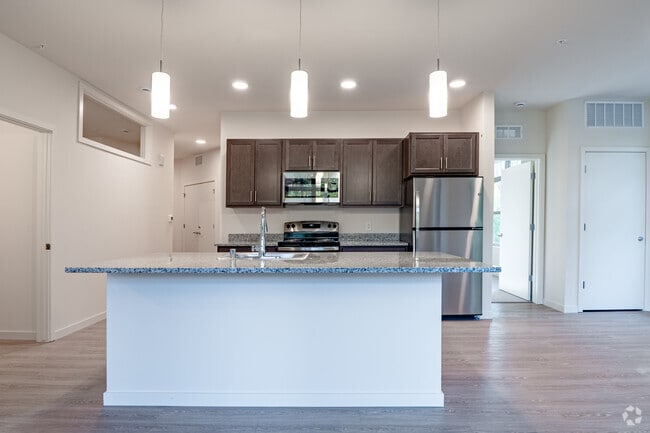 3BR, 2BA - 1,209SF - Kitchen - The Flats at Bishop's Woods