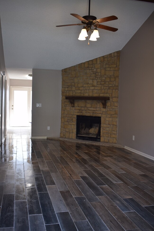 Living Room with wood looking ceramic tile - 8221 Northwest Mace Road