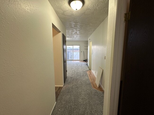 Building Photo - Spacious, three level, 4 Bed 2.5 bath Townhome in Ammon right behind the Walmart on Hitt.