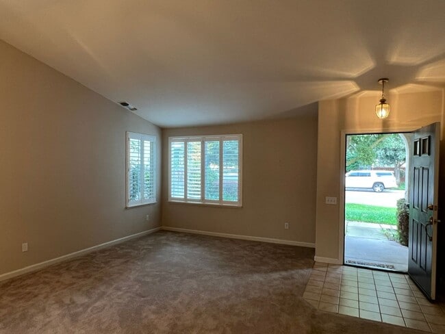 Building Photo - 4 bedrooms with 3 car garage in Rose Lane ...