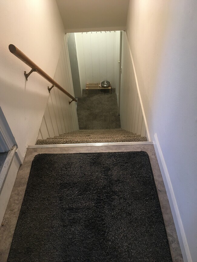 stairway to apartment - 103 W 30th Ave