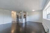 This 550 square foot apartment in Toronto offers a thoughtful blend of functionality and style. The single-floor layout comprises one bedroom, one bathroom, and an open-concept living area. The primary bedroom, measuring 140 square feet, provides a comfortable retreat.

The kitchen is a highlight, featuring sleek white cabinetry, stainless steel appliances, and a subway tile backsplash. A central island doubles as a breakfast bar, enhancing the apartment's functionality. The living room flows seamlessly from the kitchen, creating an open and airy feel.

Throughout the apartment, parquet flooring adds warmth and character, while large windows flood the space with natural light. The bathroom boasts a clean, modern aesthetic with white subway tiles and updated fixtures.

Despite its compact size, the apartment feels spacious due to its efficient design and use of light colors. Built-in storage solutions and multi-functional spaces maximize the available square footage. Located at 6 Auburndale Court in Toronto, this apartment offers a perfect blend of urban convenience and comfortable living.
