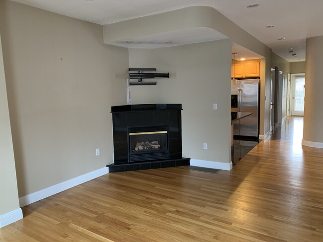 Gas fireplace with TV mount above - 106 Ashland St