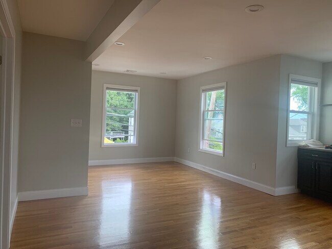 Large open living and dining area with natural light - 76 Eleanor St