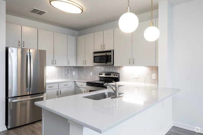 Flagstone JB 1 habitación, 1.5 baños - 871 pies cuadrados - Cocina - Mosaic Westshore Apartments
