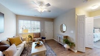 Located at 8465 Silver Maple Circle in Reynoldsburg, Ohio, this single-floor home offers a thoughtfully designed layout with a warm, neutral color palette throughout. The inviting living room features wood-look flooring, a ceiling fan with light fixture, and large windows that bring in generous natural light, creating a bright and welcoming atmosphere. A dedicated entryway with a console table and round mirror provides a functional and stylish transition into the main living space.

The living area flows seamlessly into a separate dining room, highlighted by an elegant chandelier and wood-look flooring, ideal for everyday meals or entertaining. The galley-style kitchen is equipped with rich wood cabinetry, granite-look countertops, a double sink, and white appliances including a range and refrigerator, all set on light wood-look flooring.

The bedroom is generously sized with plush carpeting, dual windows allowing for ample natural light, and a relaxed, restful ambiance. The full bathroom features tile flooring, a walk-in shower with a glass enclosure, and a wood vanity. Completing the home is an attached garage with a concrete floor and automatic opener, offering convenient parking and additional storage space.
