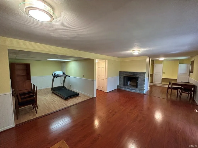 Fireplace and Gym in Basement - 129 Oak Hollow Rd