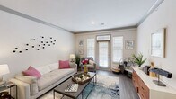 Located at 12601 Charles Farm Cir in Louisville, KY, this single-floor, 2-bedroom, 1-bathroom home offers a thoughtfully designed layout with modern finishes throughout. The living room serves as a bright, welcoming centerpiece, featuring wood-style flooring, neutral walls with gray crown molding, and large windows with transom details that invite generous natural light. The kitchen is outfitted with white cabinetry, stainless steel appliances including a refrigerator, microwave, and range, and offers a clean, efficient workspace. A connecting hallway leads to both bedrooms and the bathroom, maintaining a smooth flow through the home. The spacious primary bedroom features plush carpeting and a large window dressed with blinds and curtains, creating a comfortable retreat. The bathroom presents a granite-topped vanity with white cabinetry and a large mirror, complemented by wood-style flooring. A dedicated walk-in closet provides practical storage with wire shelving and hanging rods. The home also includes an attached garage with direct interior access, an electrical panel, and an automatic opener, adding convenience and utility to this well-rounded residential space.