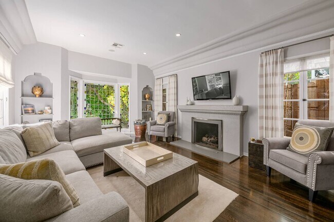 Step Down Living room with original details - 606 N Croft Ave
