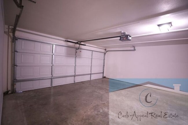 Building Photo - First month move in special $900!! Beautiful 3-bed, 2 bath condo with 2-car garage - includes was...
