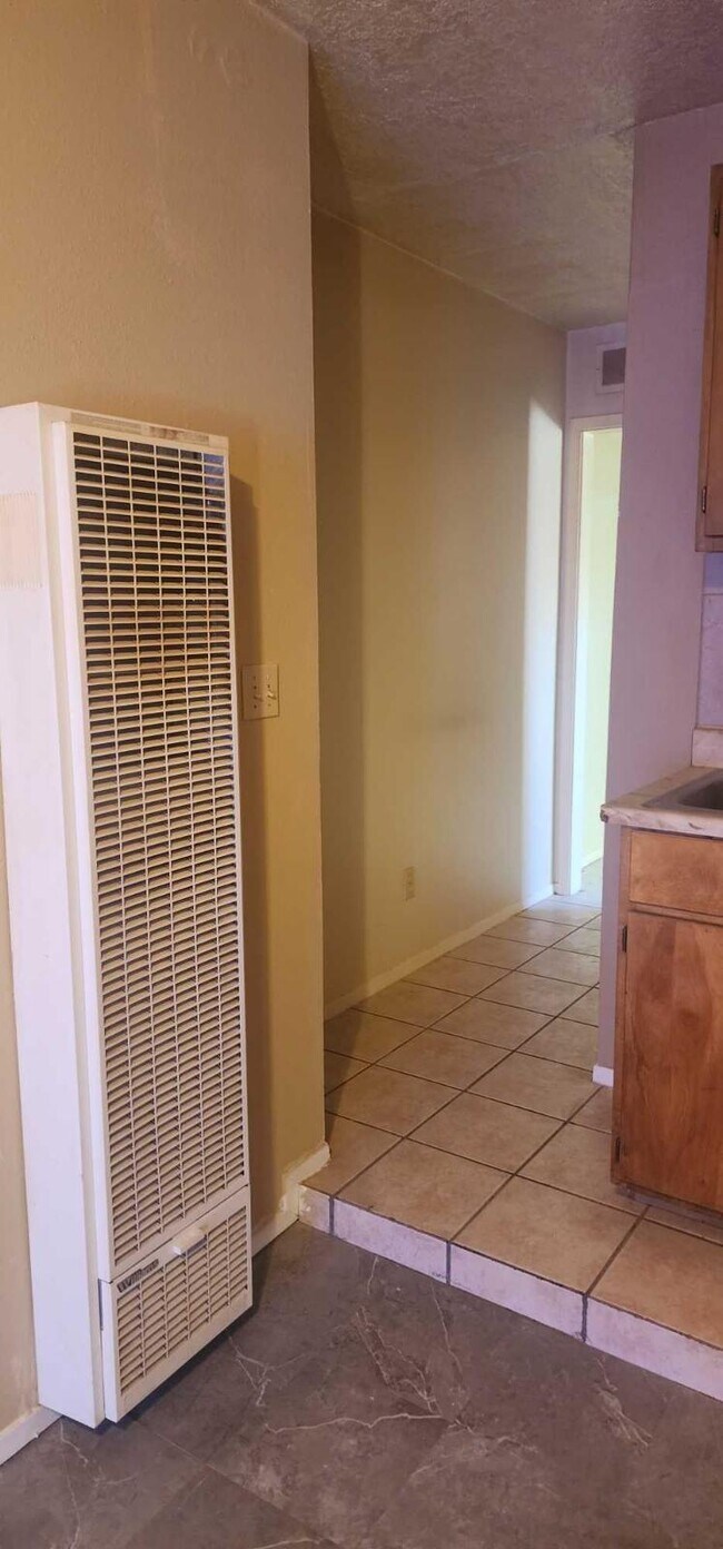 Wall heater and hallway to the bedroom - 5127 Temple Ct