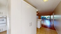 Located at 520 E Murray Canyon Dr in Palm Springs, CA, this single-story, 2-bedroom, 2-bathroom home offers a well-designed layout with a comfortable and functional flow throughout. The open-concept living and dining area is a standout feature, showcasing warm-toned hardwood flooring, recessed lighting, and a ceiling fan that contribute to a bright, airy ambiance. Sliding glass doors connect the living space to one of two covered patios, where desert landscaping, including native cacti and yucca plants, frames views of the surrounding mountains and golf course.

The kitchen is outfitted with white cabinetry featuring brushed nickel hardware, light quartz countertops, a gas cooktop, built-in microwave, dishwasher, and a double stainless steel sink beneath a window. Tile flooring and ample pantry storage complete the practical space.

Both bedrooms feature hardwood flooring and ceiling fans. The generously sized primary bedroom includes multiple closets. The two bathrooms offer clean, updated finishes — one with a glass-enclosed walk-in shower with grab bars, and the other with a tub-shower combo behind sliding glass doors and a quartz vanity. Additional highlights include a laundry area, utility room, hallway, and six closets providing exceptional storage throughout.