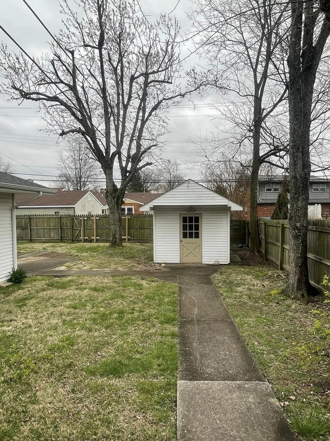 fenced in yard with storage - 1506 Tamarack Rd