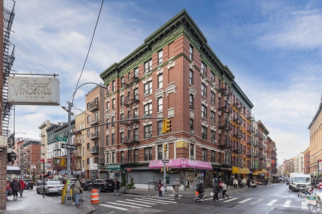 Tenement residents with tall windows can catch views of the bustling Little Italy neighborhood below.